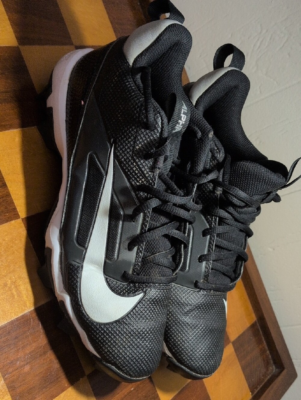 Nike Black and White Youth  Athletic Cleats Alpha  6Y